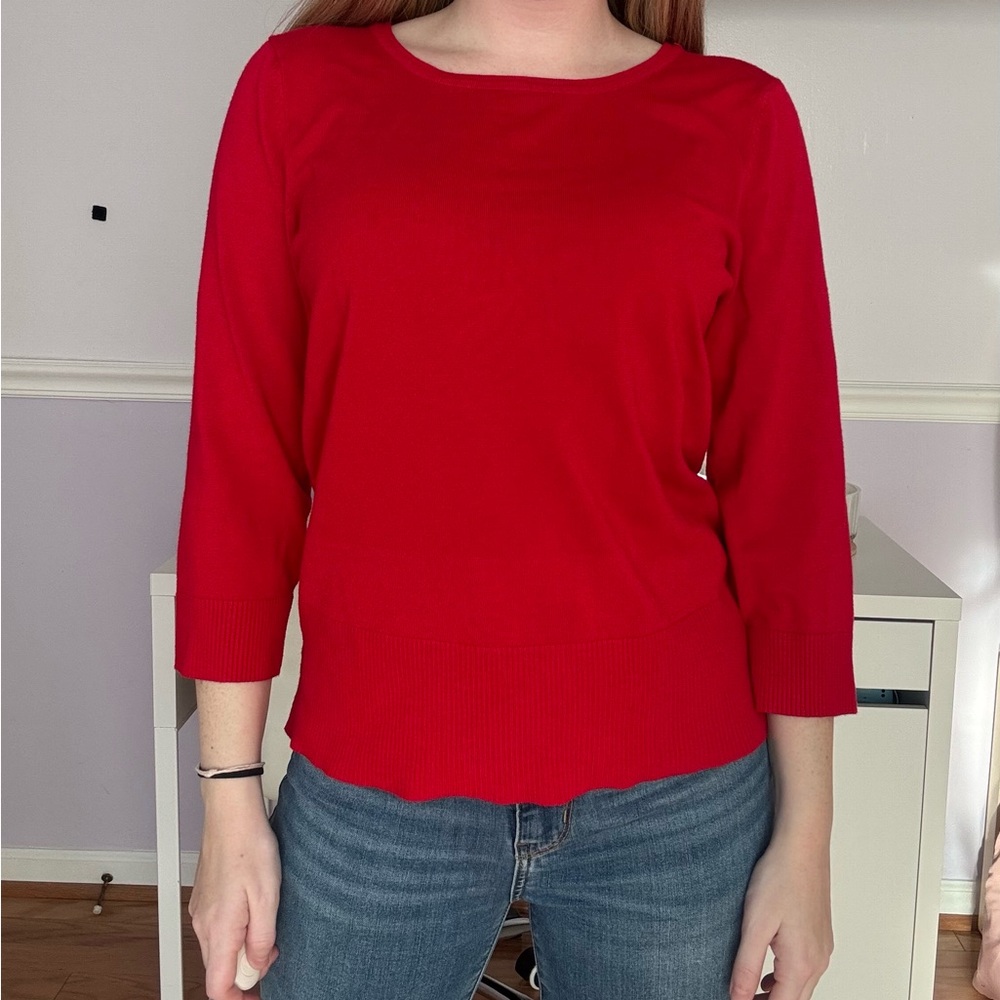 Red 3/4 sleeve sweater. Tie up in back.